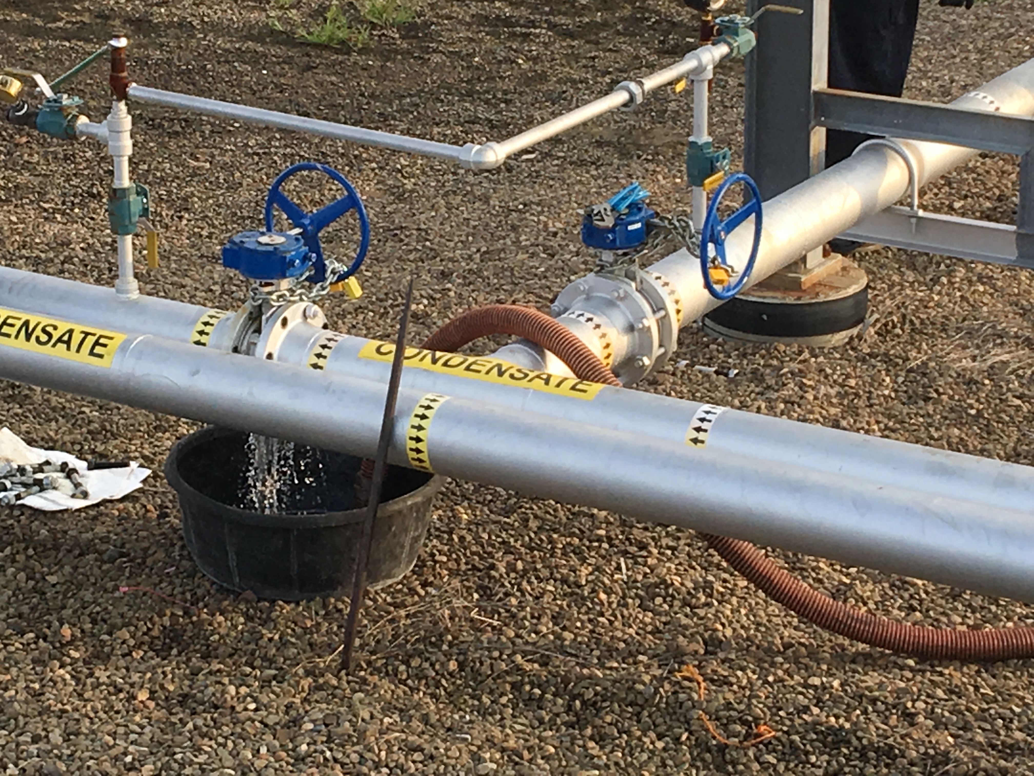 Condensate transfer piping with hand-wheel gate valves during commissioning pressure test